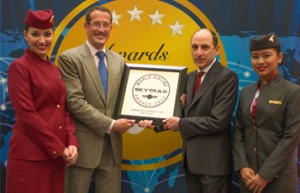 A proud Qatar Airways Chief Executive Officer Akbar Al Baker is presented with the Skytrax 2013 Best Business Class In The World award by CNN International anchor Richard Quest, flanked by cabin crew, at the Paris Air Show today. Qatar Airways won a total of three Skytrax World Airline awards this year.