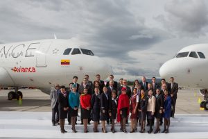 Star Alliance Executives and staff in uniform pose with Avianca and Taca aircraft (2)