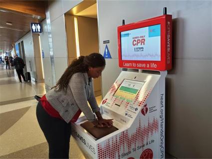 Torrance CitiCABLE reporter Jesse Pierre practiced CPR using the hands-only CPR kiosk.