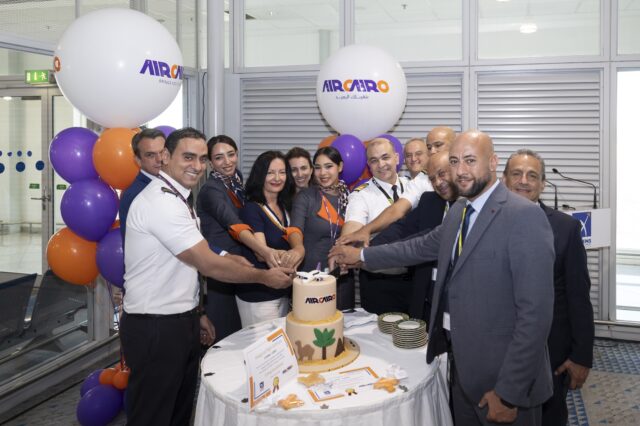 AIRCAIRO crew and Athens International Airport staff cut a ceremonial cake to mark the airline's inaugural flight to Athens.
