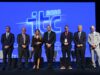 Panelists and moderator pose on stage in front of the ITC 2026 logo at the 9th Infrastructure and Transport Conference in Athens.