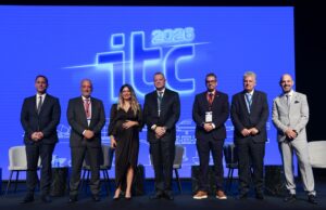 Corfu Port: cruise passengers up 20.1% in nine months of 2026 Panelists and moderator pose on stage in front of the ITC 2026 logo at the 9th Infrastructure and Transport Conference in Athens.